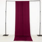 Burgundy 4-way stretch spandex event curtain drapes on a backdrop stand.