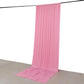 Pink 4-way stretch spandex event curtain drapes hanging as a backdrop.
