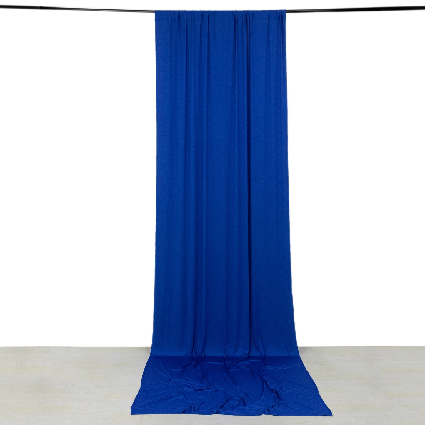 Royal blue 4-way stretch spandex event curtain drapes hanging on a rod.
