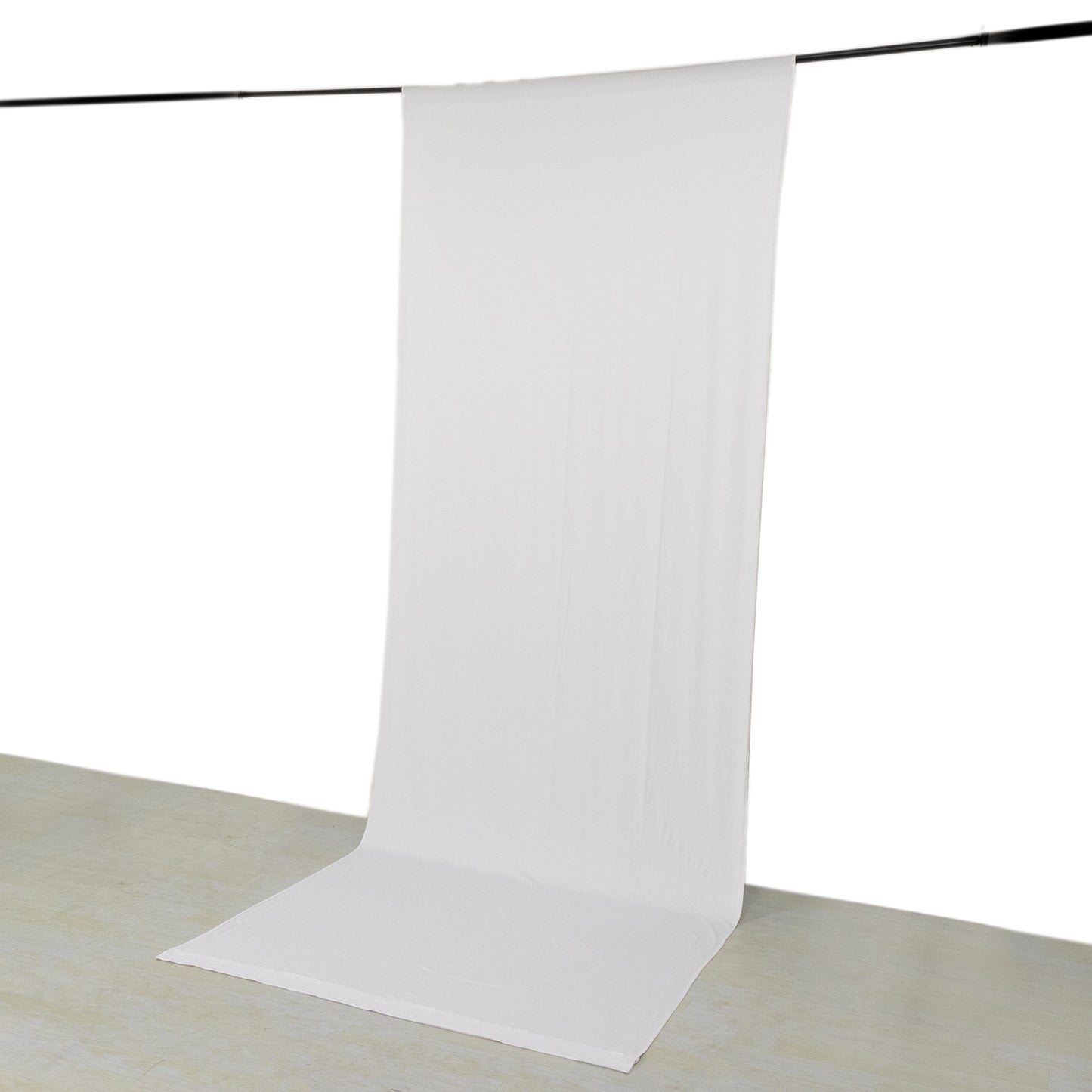 White 4-way stretch spandex event curtain drapes hanging as backdrop.