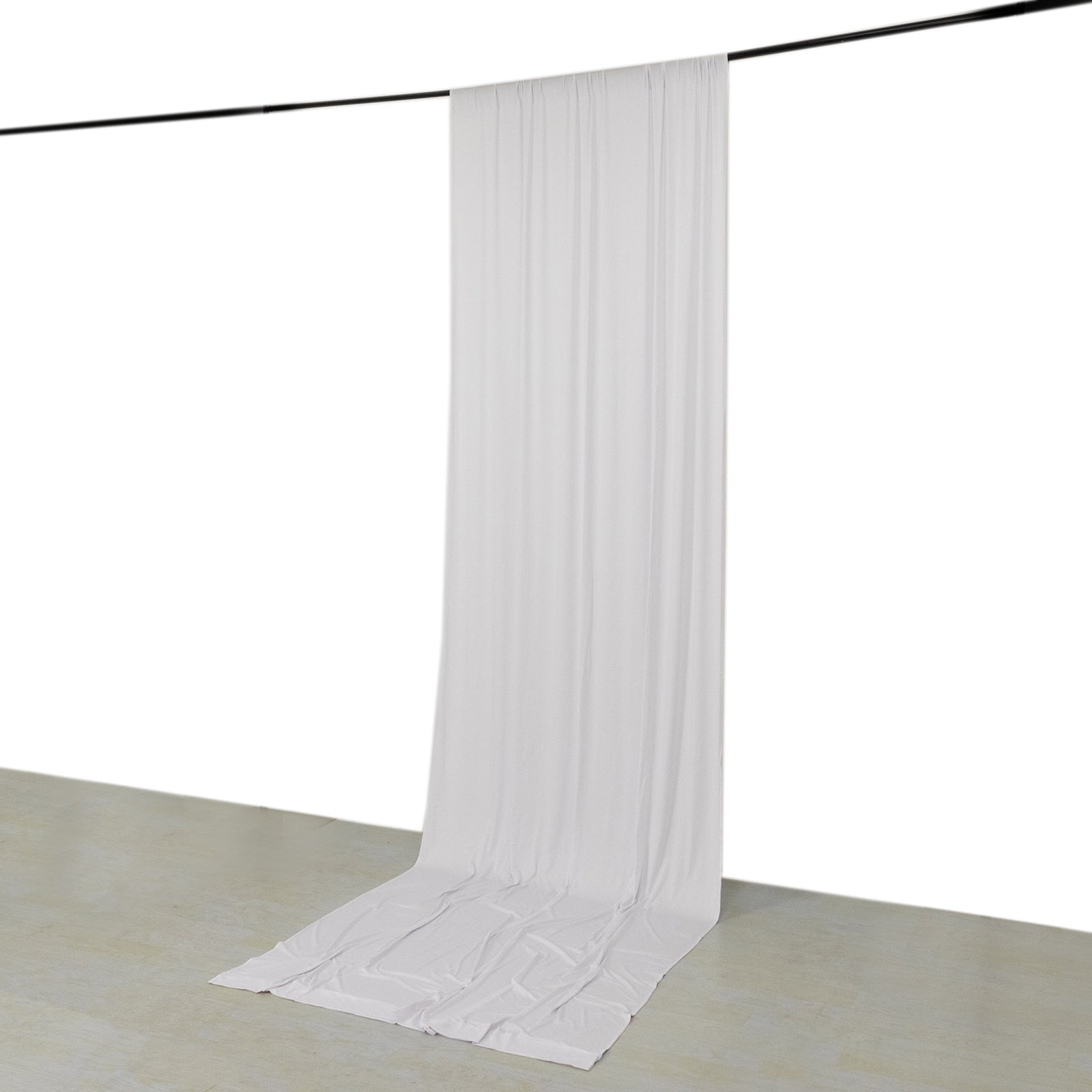White 4-way stretch spandex event curtain drapes hanging from a rod.