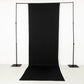 Black 4-way stretch spandex event curtain drapes on a backdrop stand.