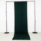 Hunter emerald green 4-way stretch spandex event curtain drapes on display.