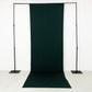 Emerald green 4-way stretch spandex event curtain drapes on a backdrop stand.