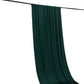Emerald green 4-way stretch spandex event curtain drapes on a rod.