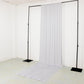 White spandex event curtain drapes on a backdrop stand.