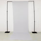 White 4-way stretch spandex event curtain drapes with rod pockets.