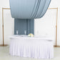 Dusty blue 4-way stretch spandex backdrop drapes elegantly over a table.
