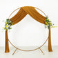 Gold 4-way stretch spandex drapes with floral accents on a circular backdrop.