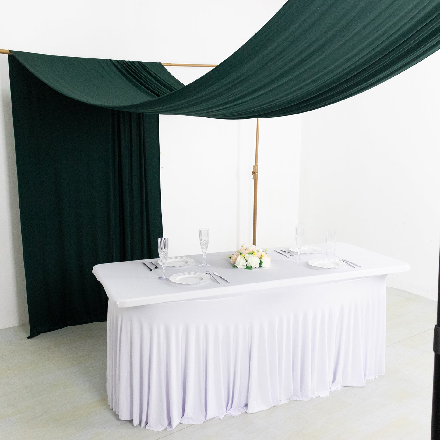 Emerald green 4-way stretch spandex event curtain drapes backdrop.