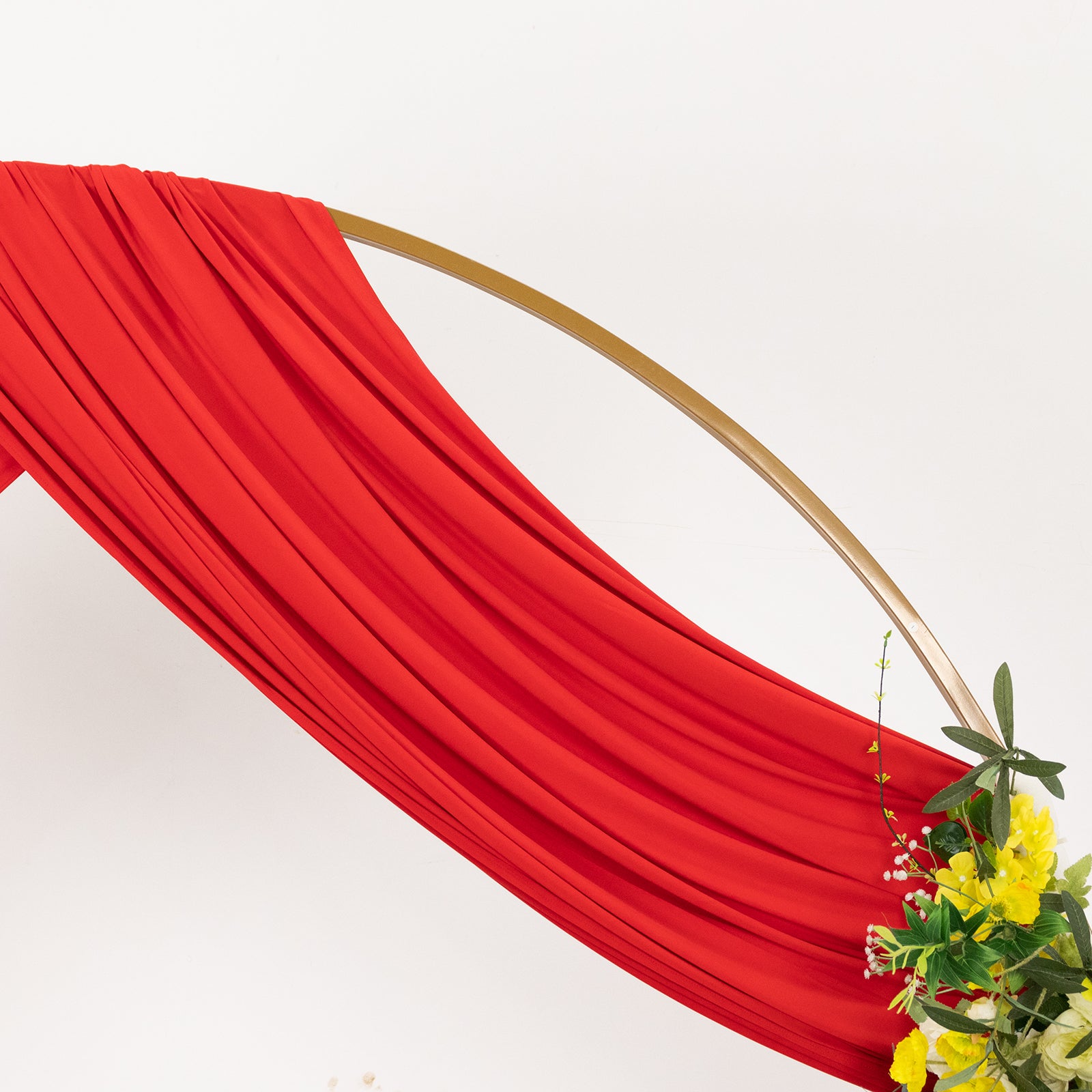 Red 4-way stretch spandex event curtain drapes with rod pockets.