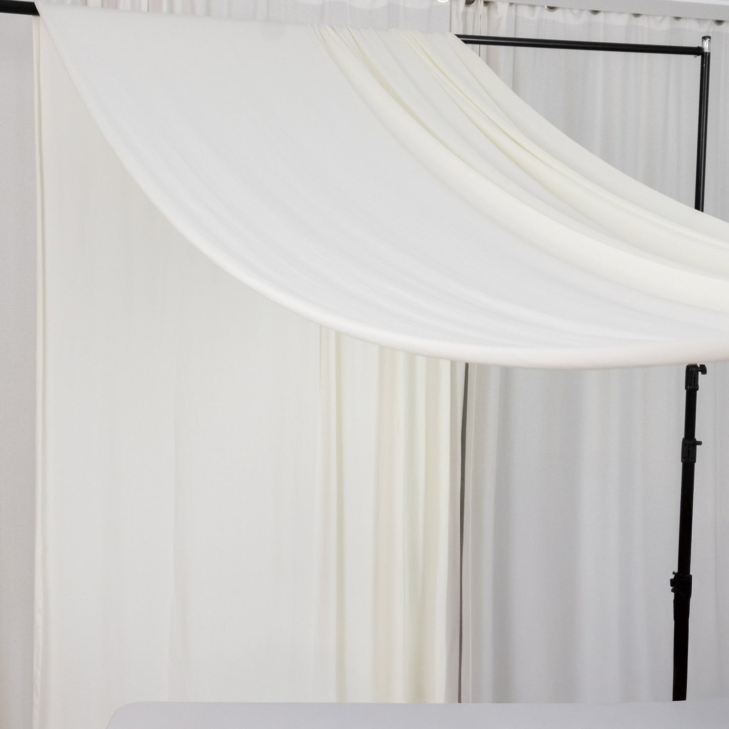 Ivory 4-way stretch spandex event curtain drapes, wrinkle-free backdrop panel.