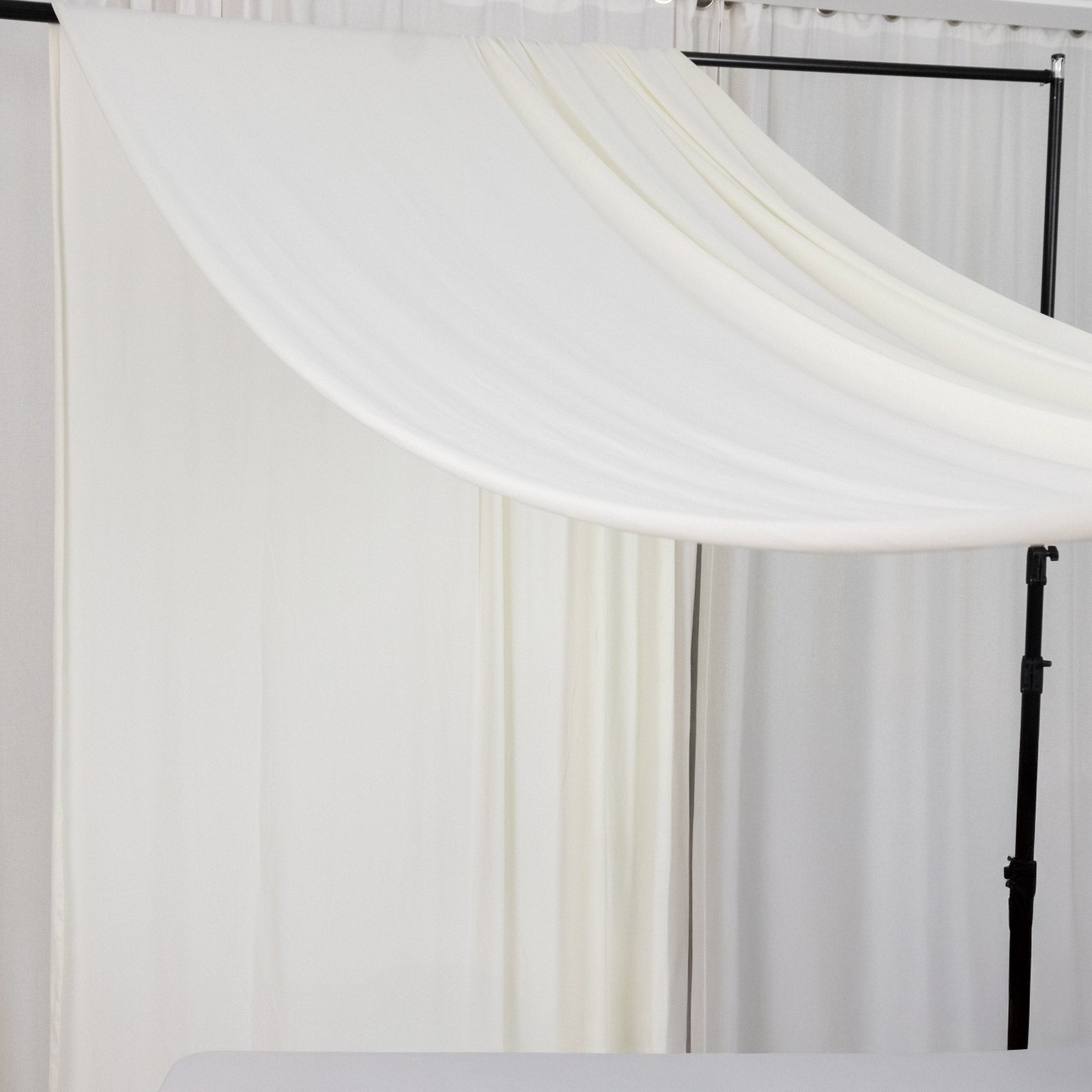 Ivory 4-way stretch spandex event curtain drapes, wrinkle-free backdrop panel.