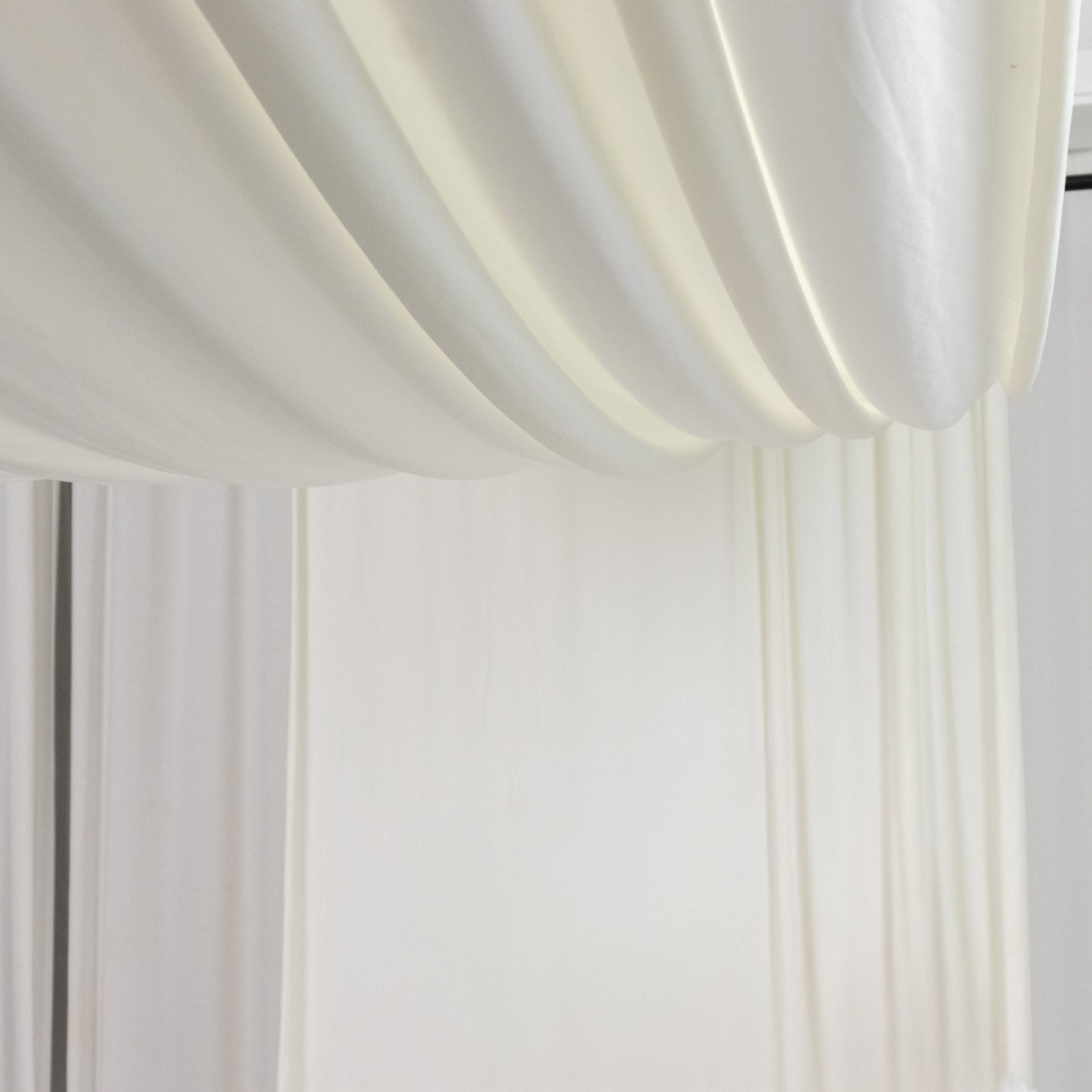 Ivory 4-way stretch spandex event curtain drapes, wrinkle-free backdrop panel.