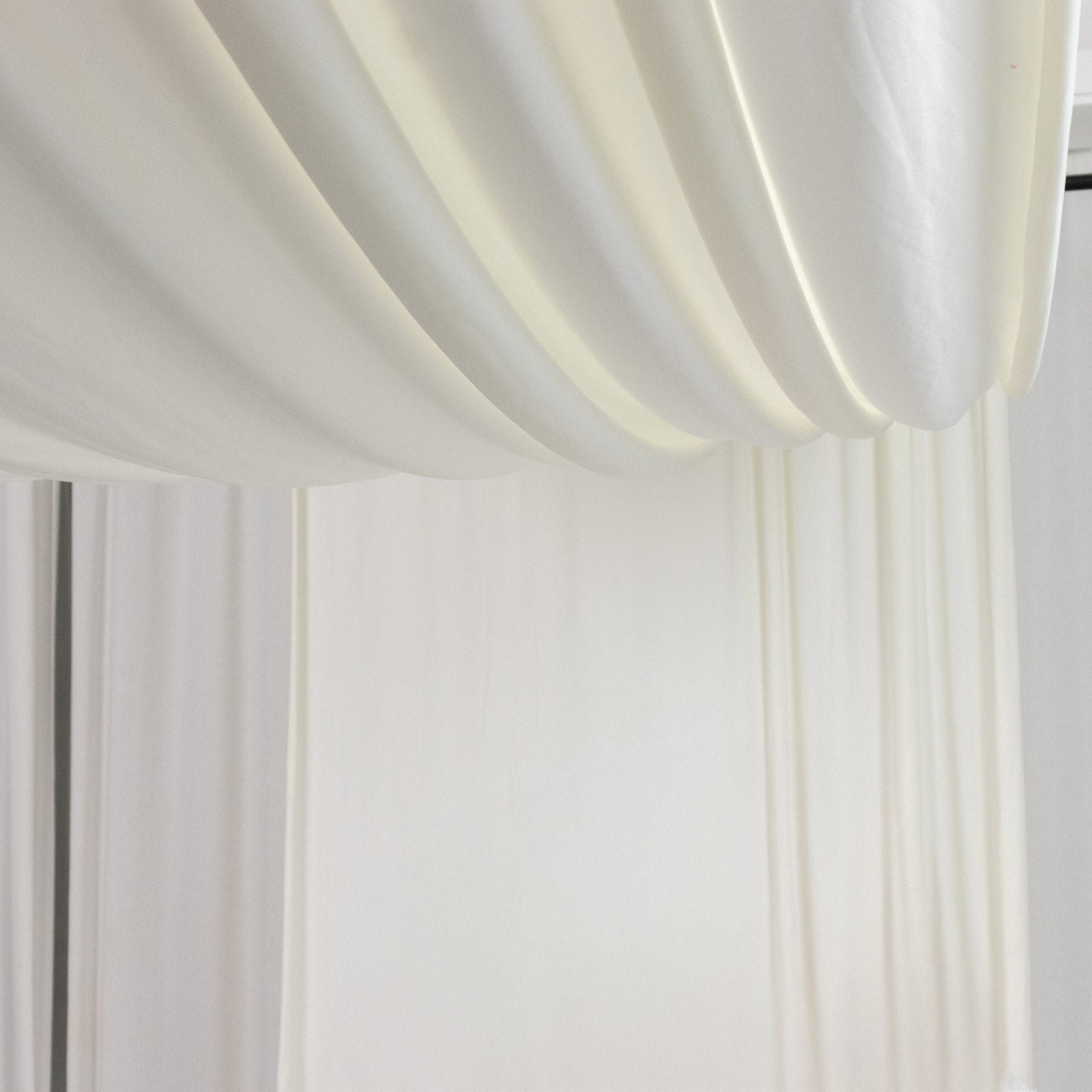 Ivory 4-way stretch spandex event curtain drapes, wrinkle-free backdrop panel.