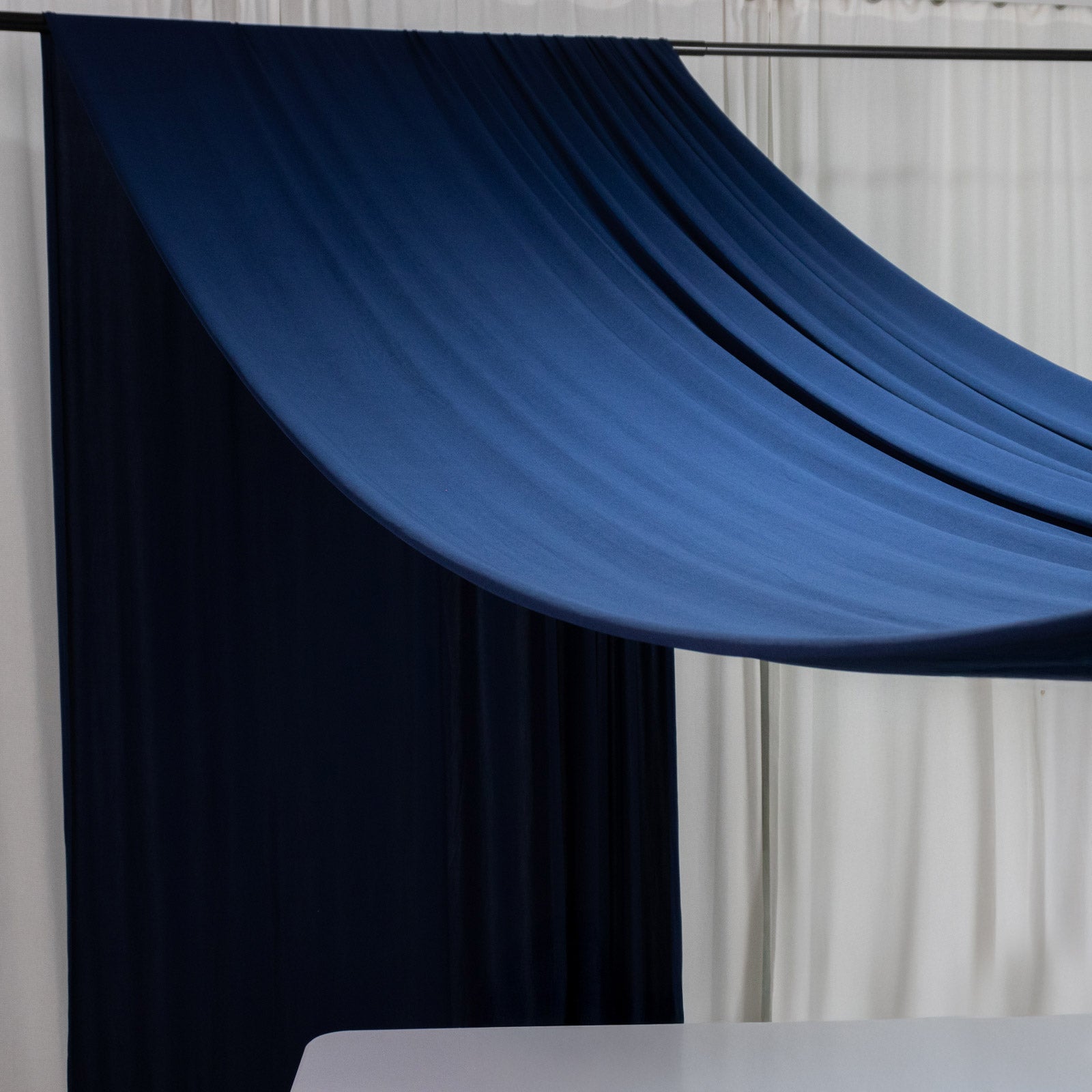 Navy blue 4-way stretch spandex event curtain drapes, wrinkle-free backdrop.