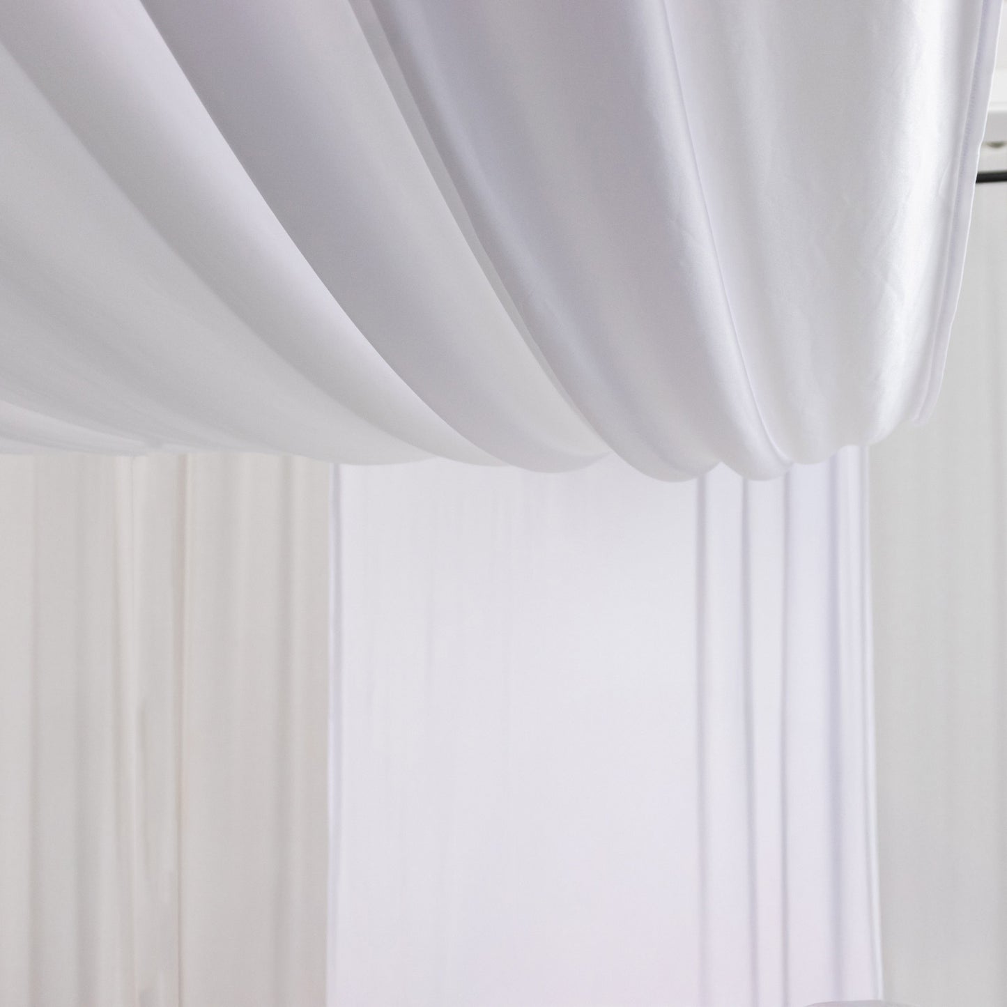 White 4-way stretch spandex event curtain drapes, wrinkle-free backdrop panel.
