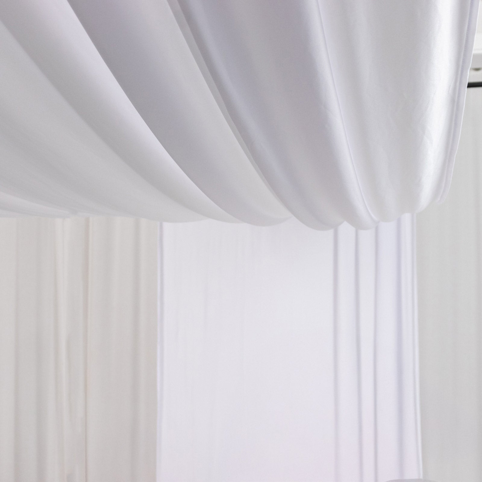White 4-way stretch spandex event curtain drapes, wrinkle-free backdrop panel.