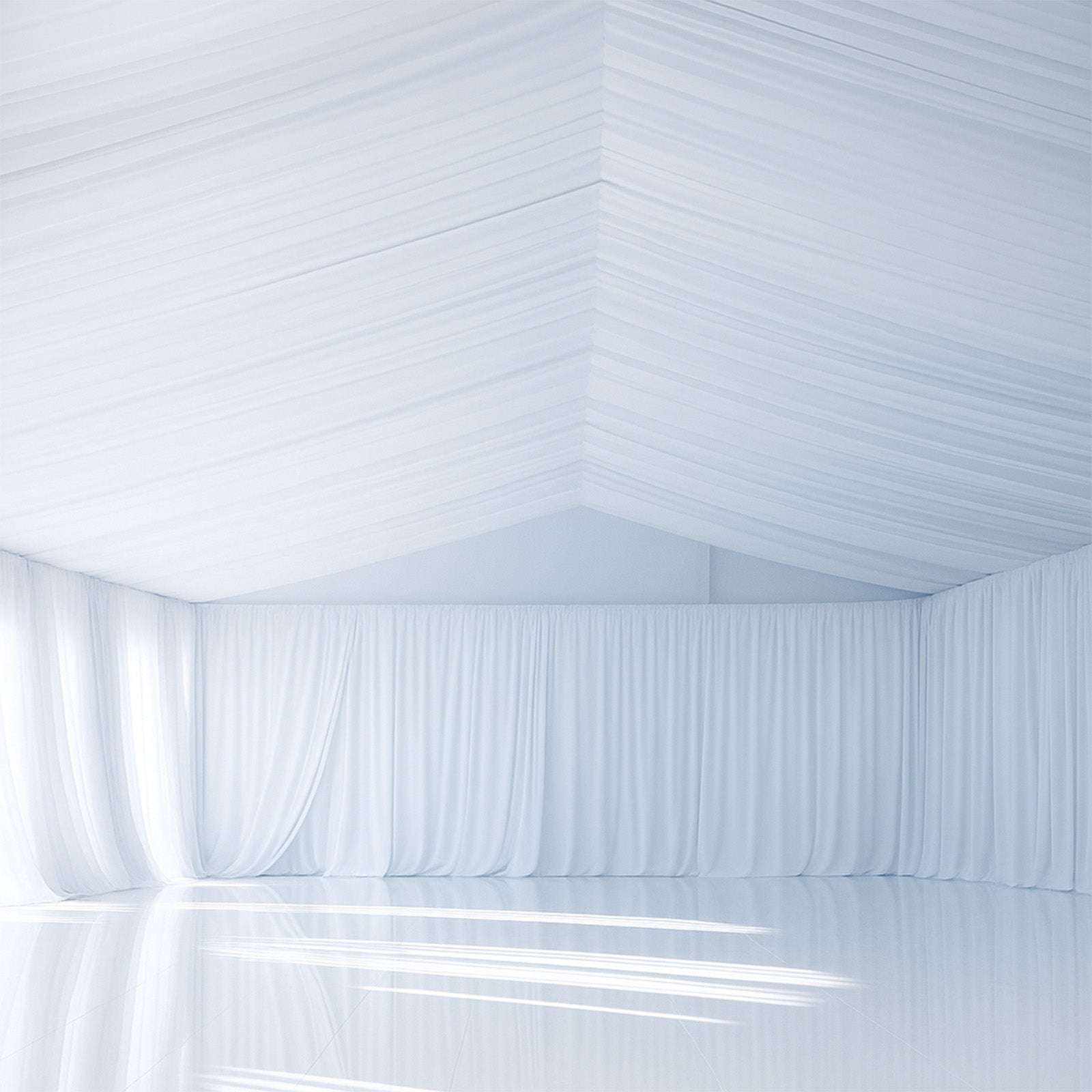 White stretch spandex tent ceiling drape in a spacious venue.