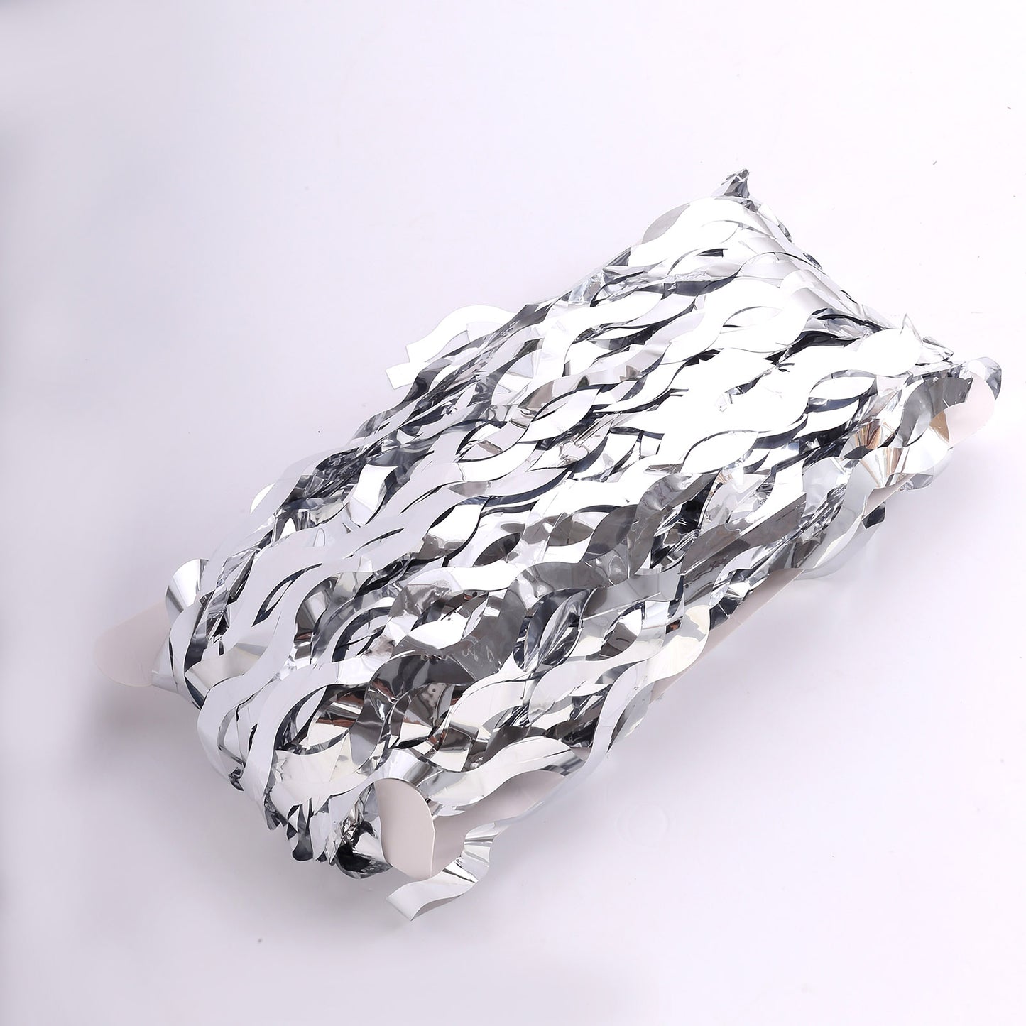 Metallic silver wavy foil fringe party backdrop curtain. #whtbkgd