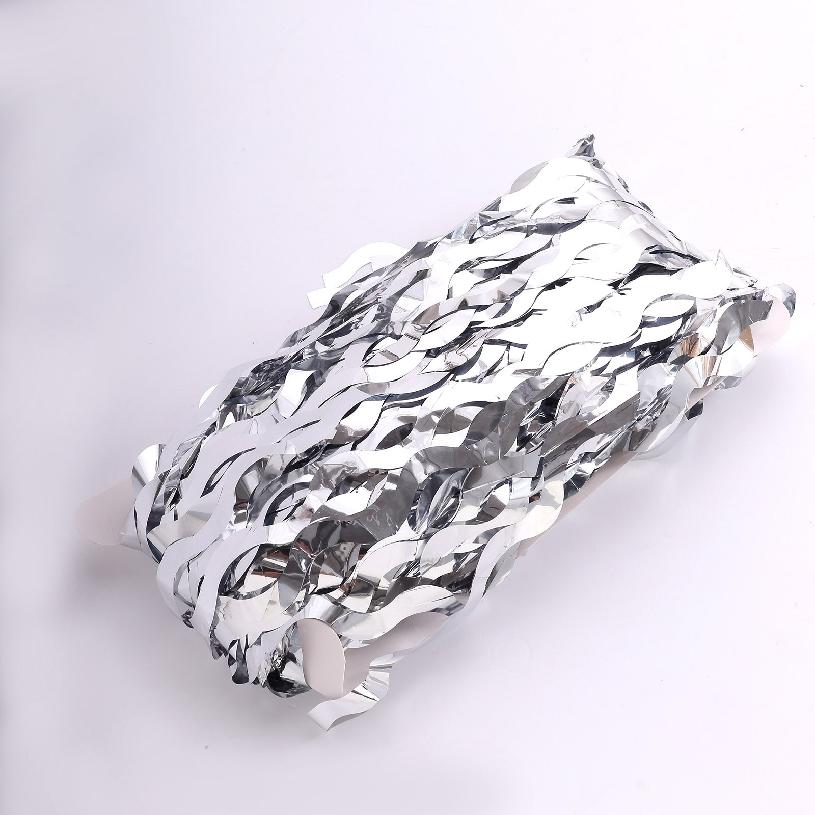 Metallic silver wavy foil fringe party backdrop curtain. #whtbkgd
