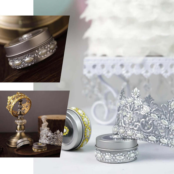 Silver rhinestone gems and decorative accessories on a wooden surface.