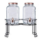 Clear dual gallon glass jars dispenser with rose gold lids.