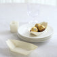Natural biodegradable wooden boat-shaped food plates on a table.