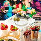 Tropical leaf party picks in colorful cocktails and fruit displays.
