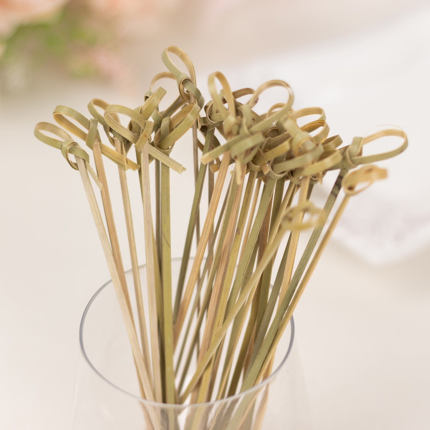 Eco-friendly twisted knot bamboo cocktail sticks in natural color.