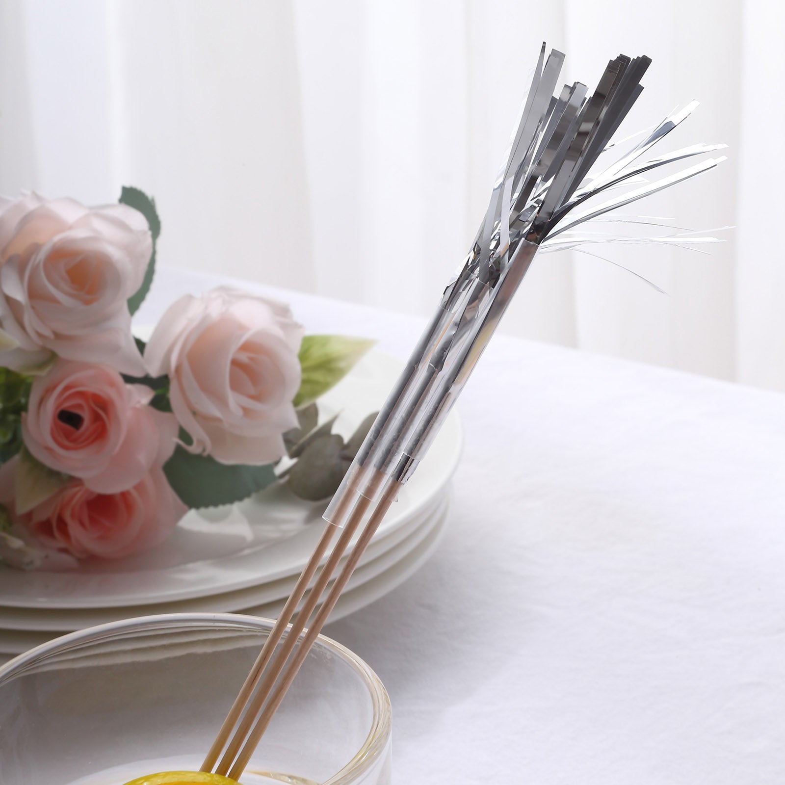 Silver firework frills cake toppers in a decorative setting.