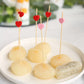 Red and pink eco-friendly bamboo heart skewers on appetizers.