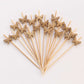 Natural bamboo butterfly cocktail sticks for eco-friendly parties.
