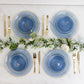 Transparent dusty blue disposable bowls with gold rim and elegant swirl design.