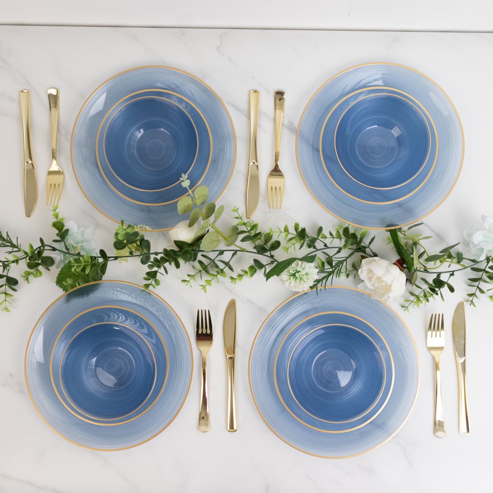 Transparent dusty blue disposable bowls with gold rim and elegant swirl design.