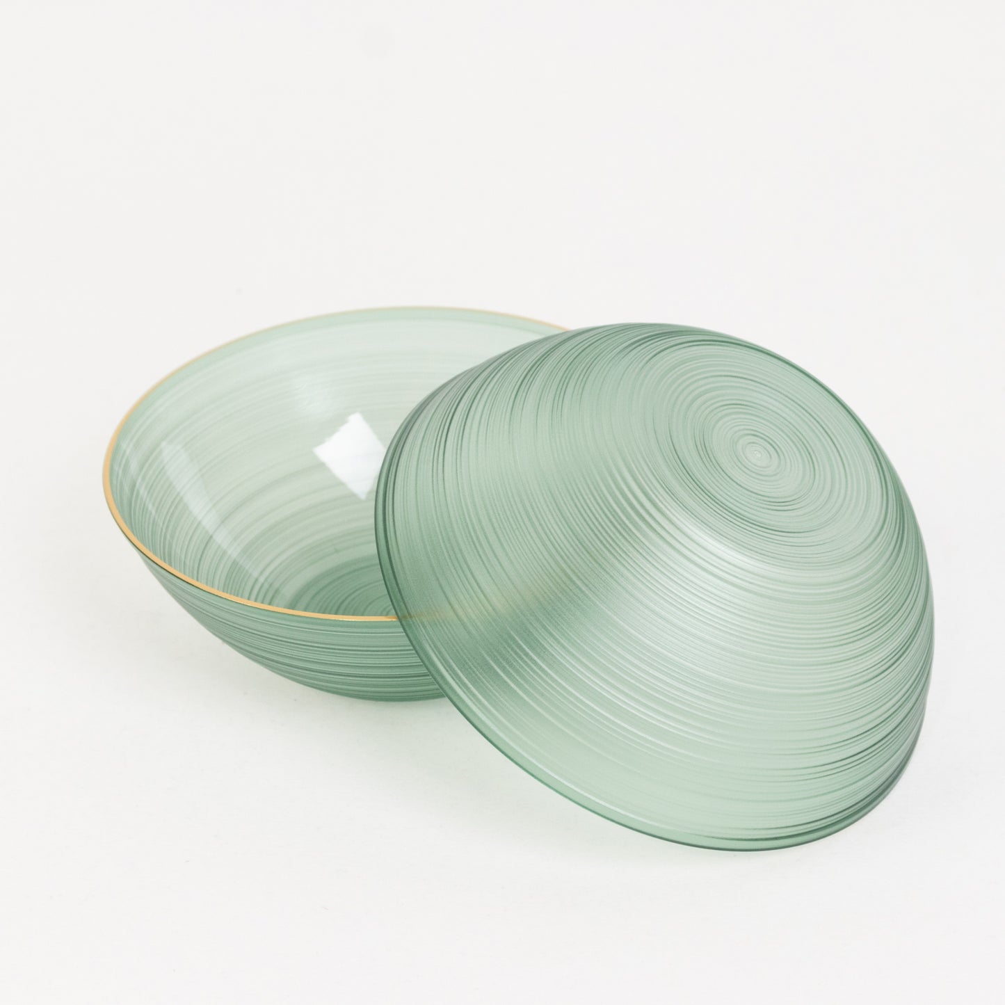 Transparent dusty sage green disposable bowl with gold rim.