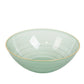Transparent dusty sage green bowl with a gold rim and elegant swirl design.