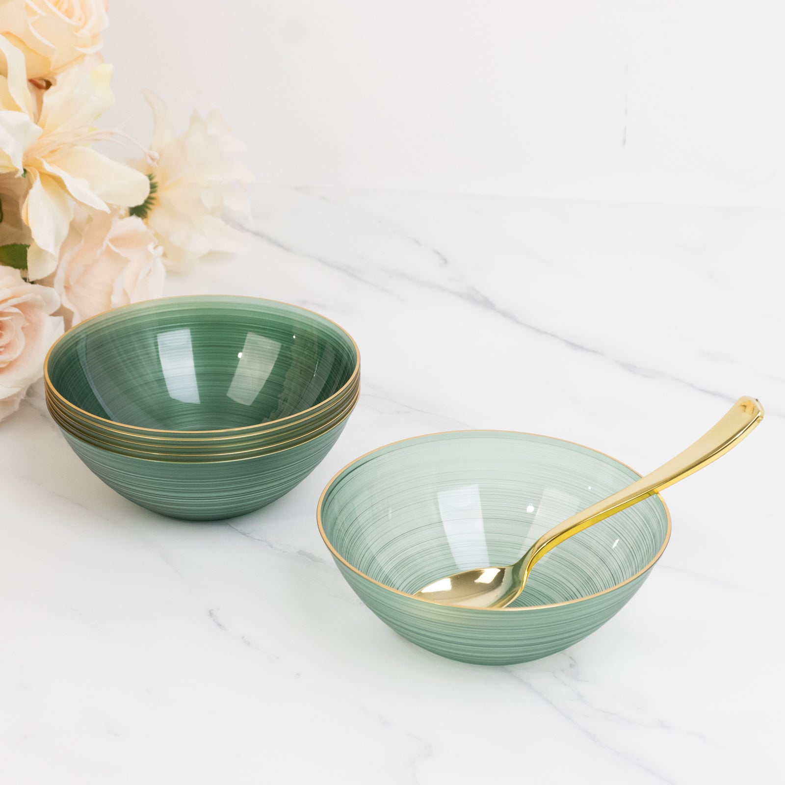 Transparent dusty sage green disposable bowls with gold rim.