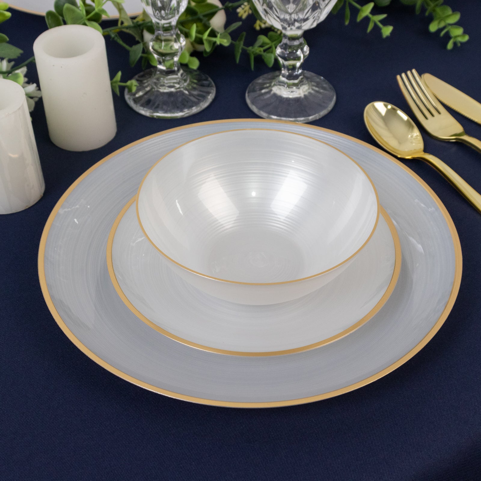 Transparent pearl white bowls with gold rim, elegant swirl design.