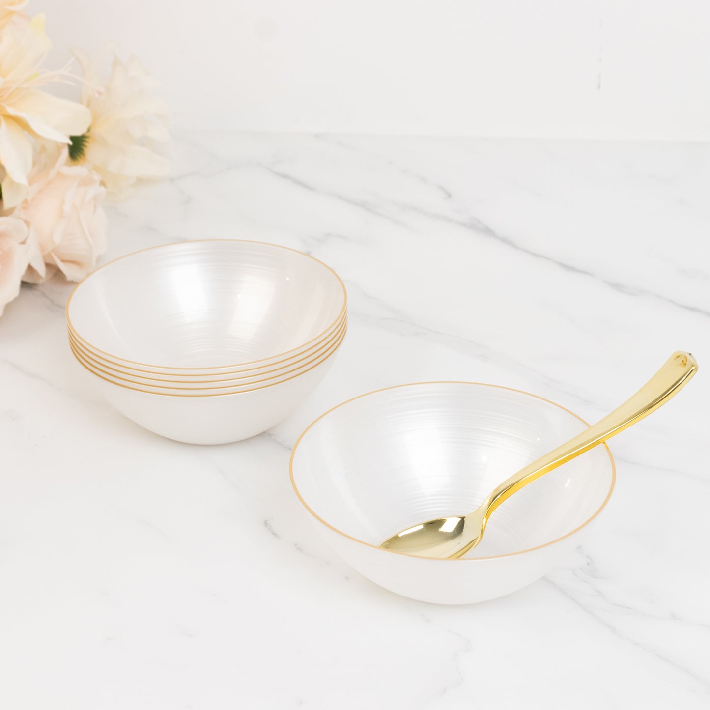 Transparent pearl white bowls with gold rim, elegant crystal-like swirl design.