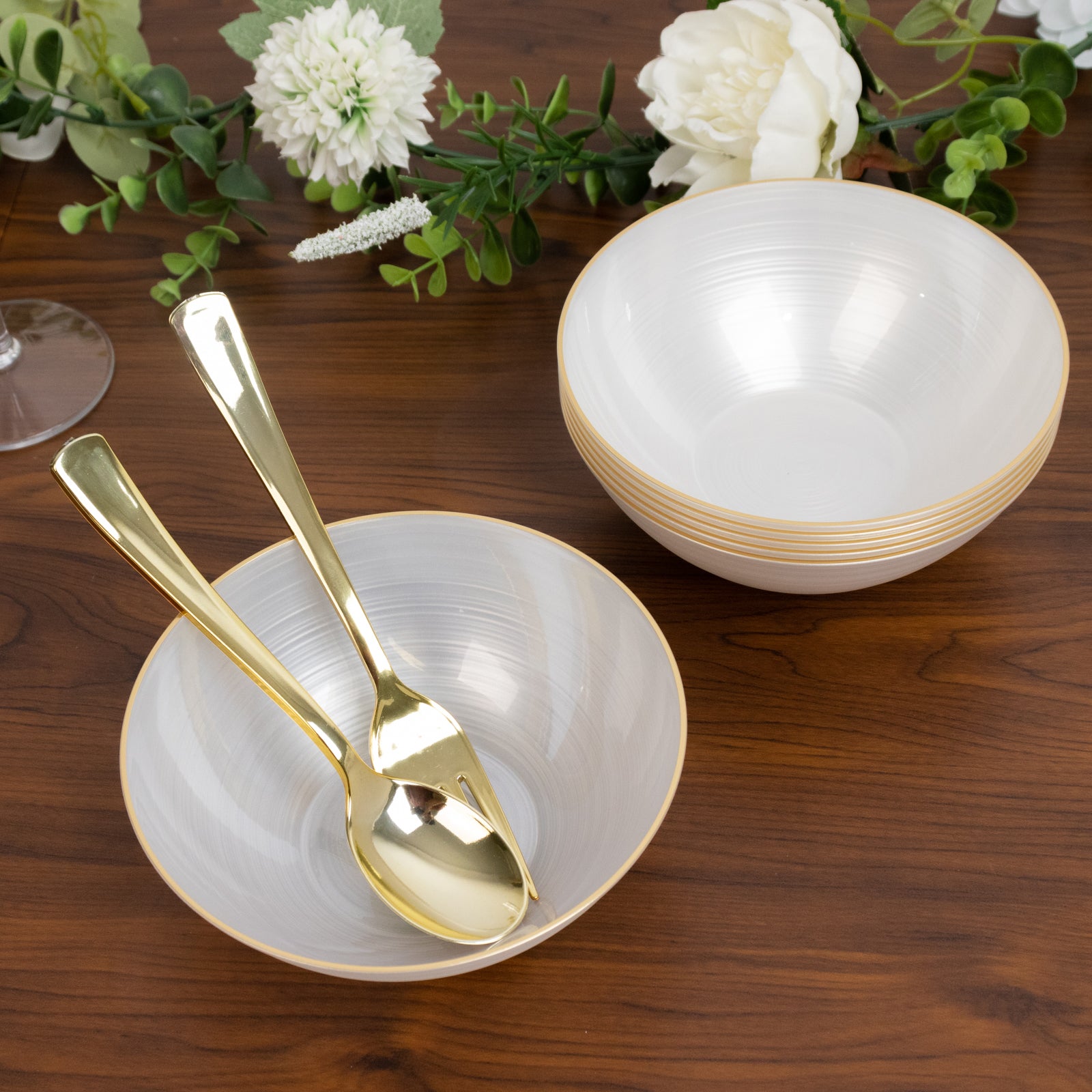 Transparent pearl white bowls with gold rim, elegant crystal-like swirl design.