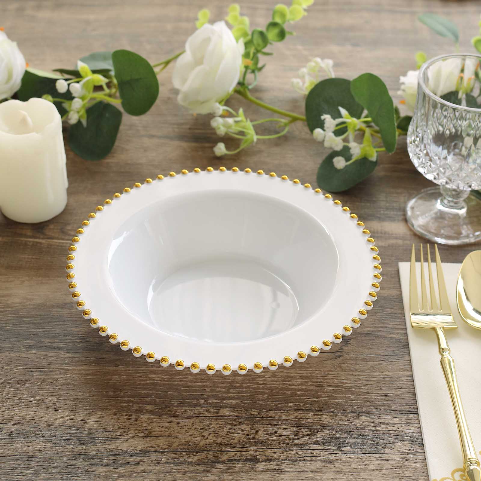 White round plastic dessert bowl with gold beaded rim.