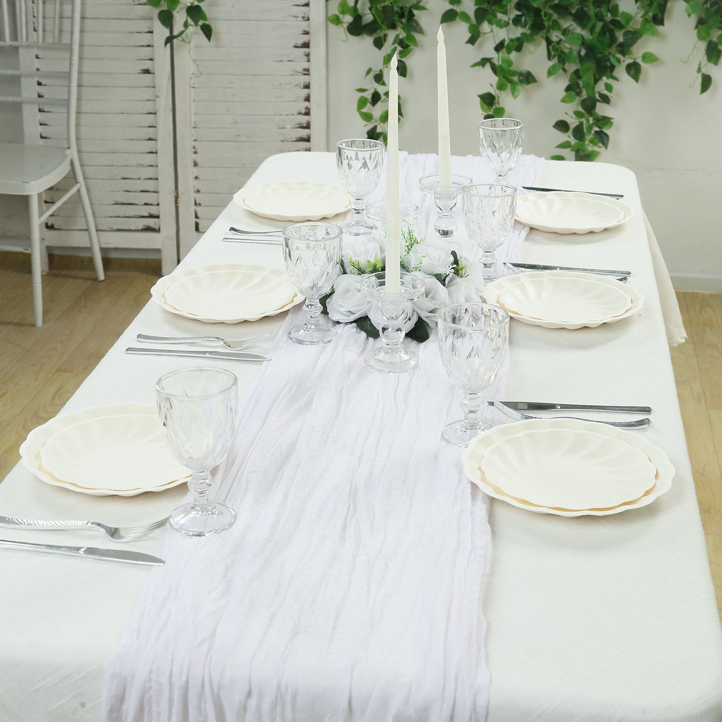 Cream biodegradable salad plates on an elegant table setting.