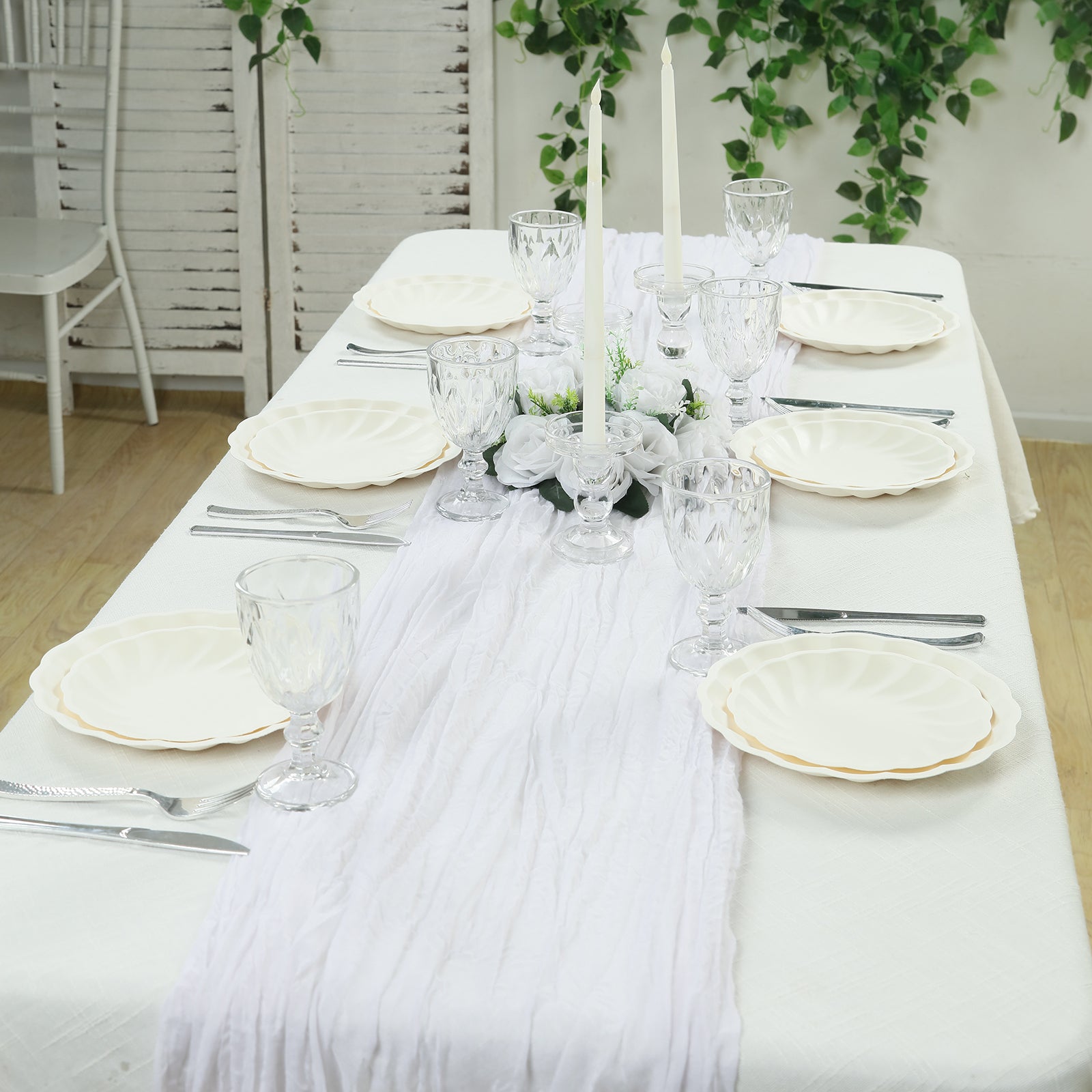 Cream biodegradable salad plates on an elegant table setting.