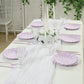 Lavender lilac biodegradable salad plates set on a table with floral decor.