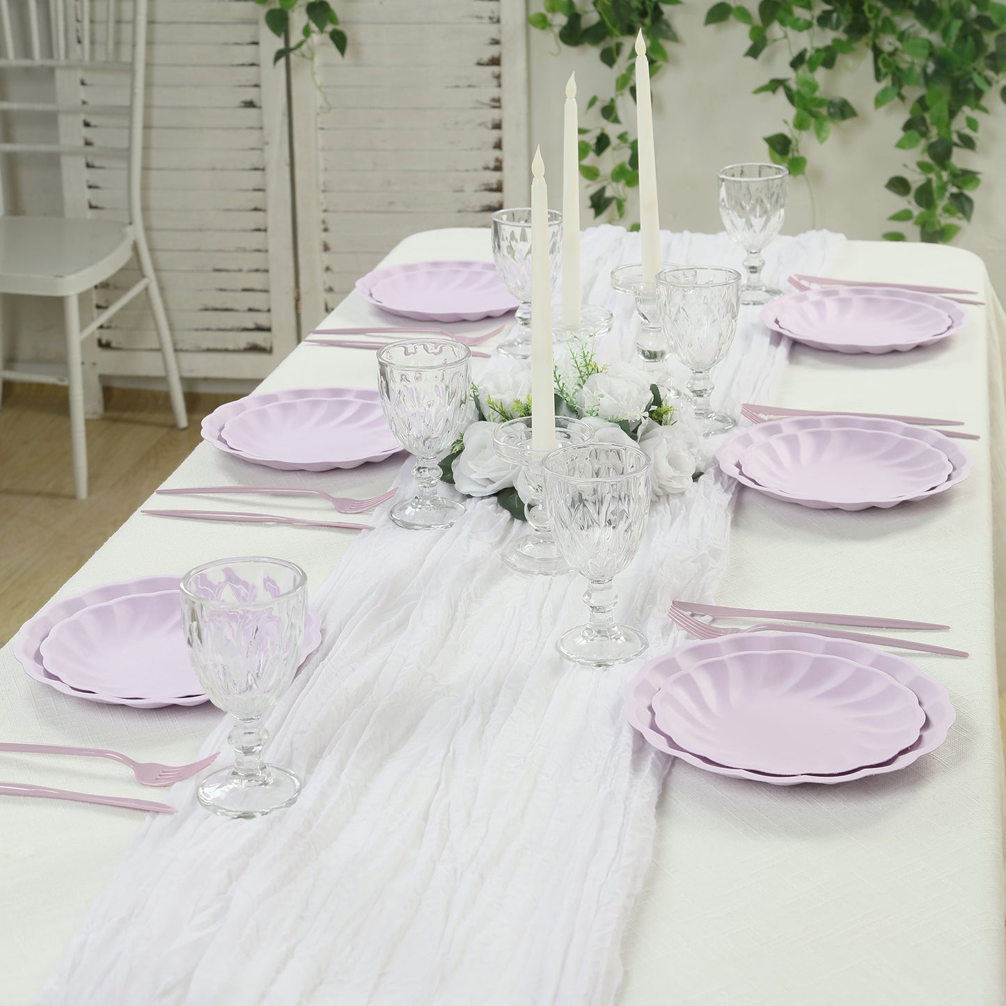 Lavender lilac biodegradable salad plates set on a table with floral decor.