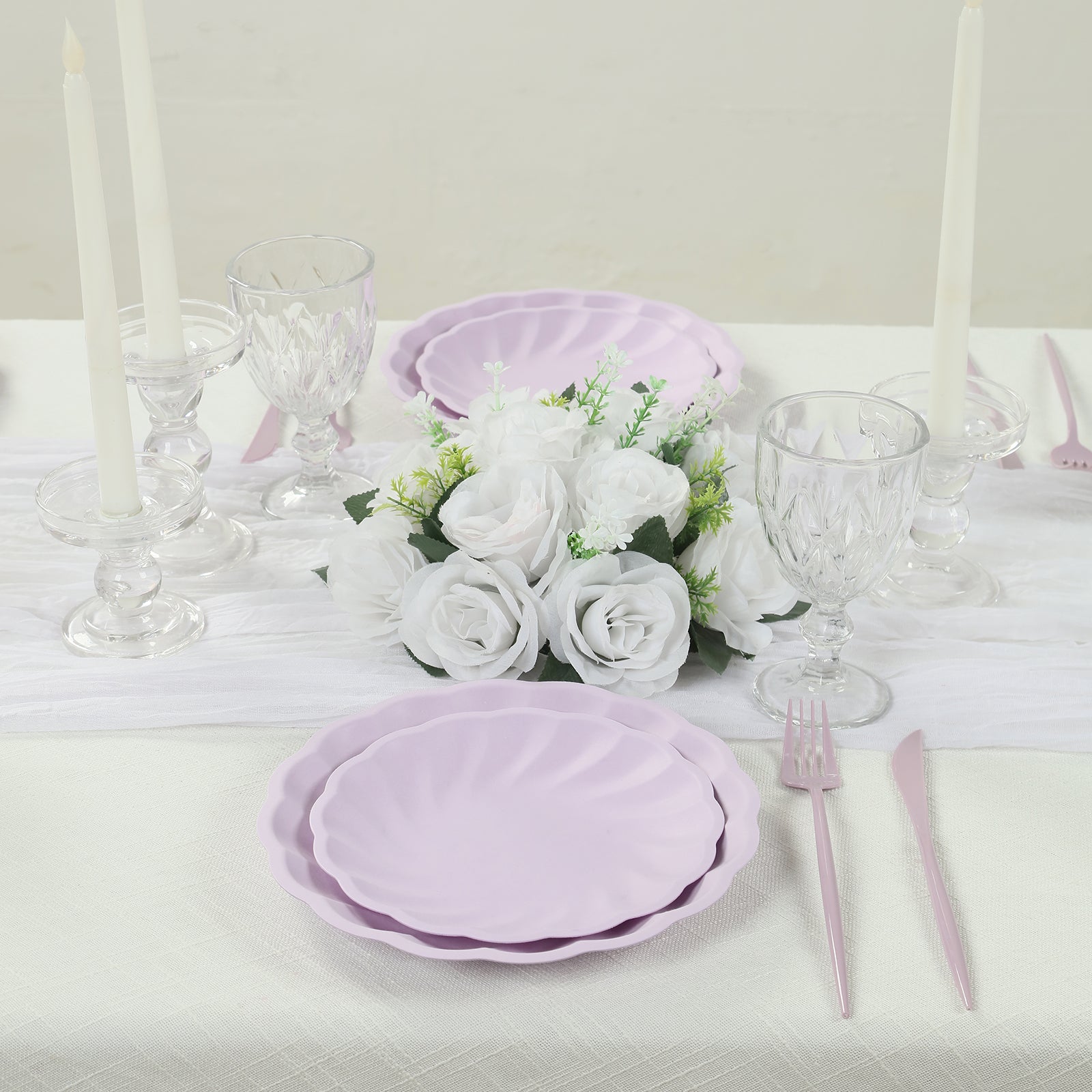 Lavender lilac biodegradable salad plates on an elegant table setting.