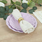 Lavender lilac biodegradable salad plates with a white napkin and gold ring.