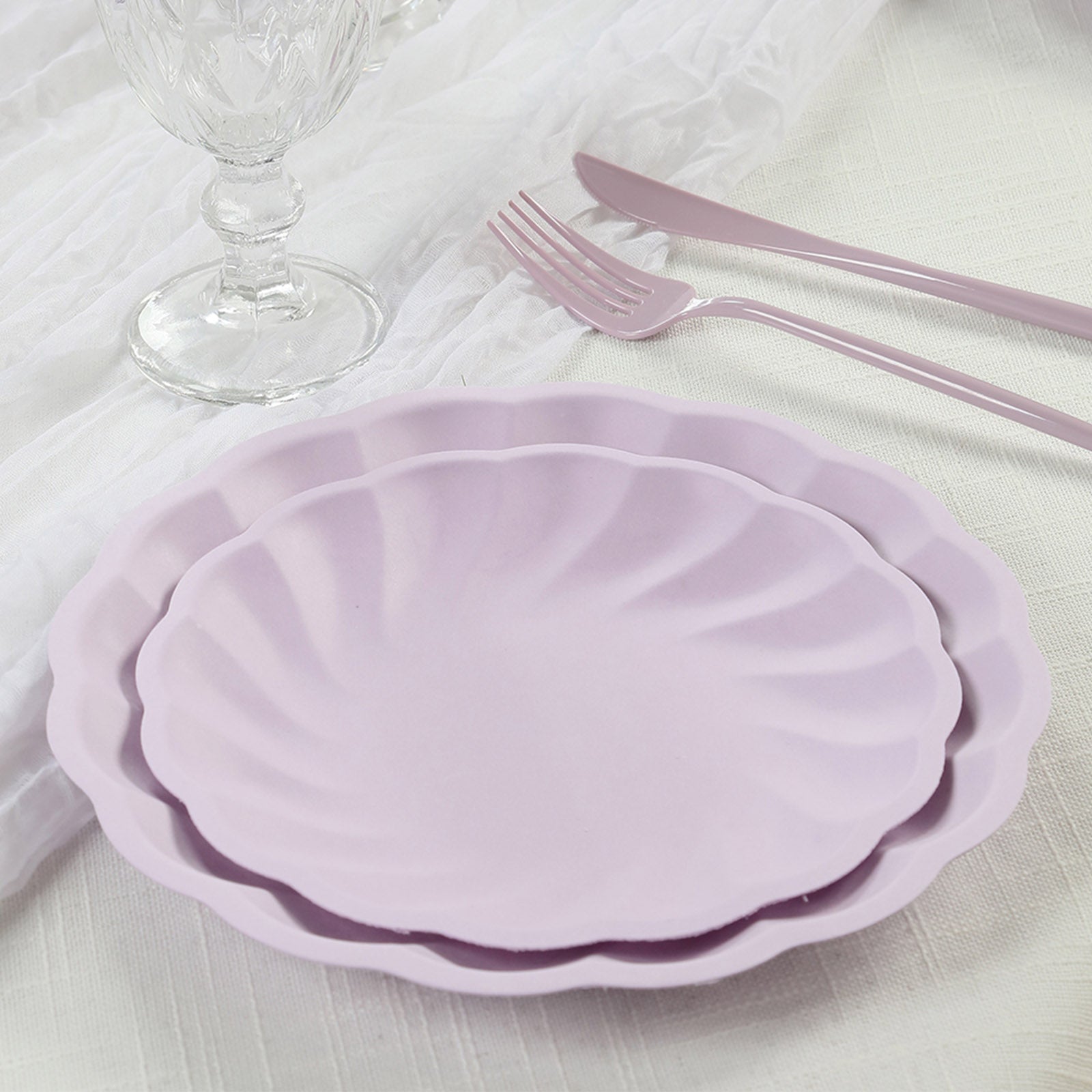 Lavender lilac biodegradable salad plates with scalloped edges.