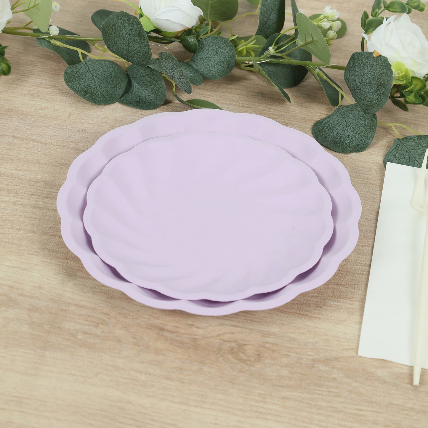 Lavender lilac biodegradable salad plates with scalloped edges.